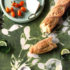 Close up of olive toned Porto print pattern on Made Brave tablecloth