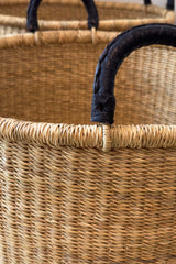 Made Brave large leather handle hamper styled in a laundry room