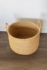 Made Brave short hamper styled under a bench