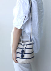 Made Brave Sencilla mochila bag styled crossbody in beige