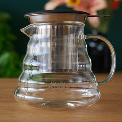 Small glass teapot for two cups of tea side view