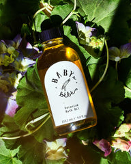 Veranium bath oil poured into bath water by Made Brave