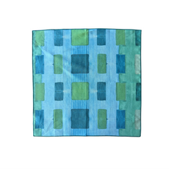Made Brave blue tapestry napkin styled on a set table
