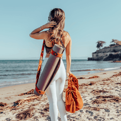 Made Brave Terracotta mochila bag styled crossbody on a shoulder