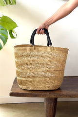 Made Brave natural string basket tote styled on a bench