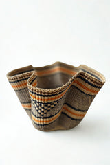 Handwoven wave basket in earth color stripes made in Ghana for Made Brave