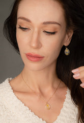 Close up of resin flower pendant on Made Brave In Bloom necklace
