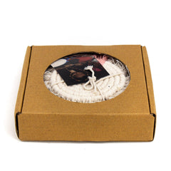 Macrame Coasters with fringe edge on a wood coffee table Made Brave