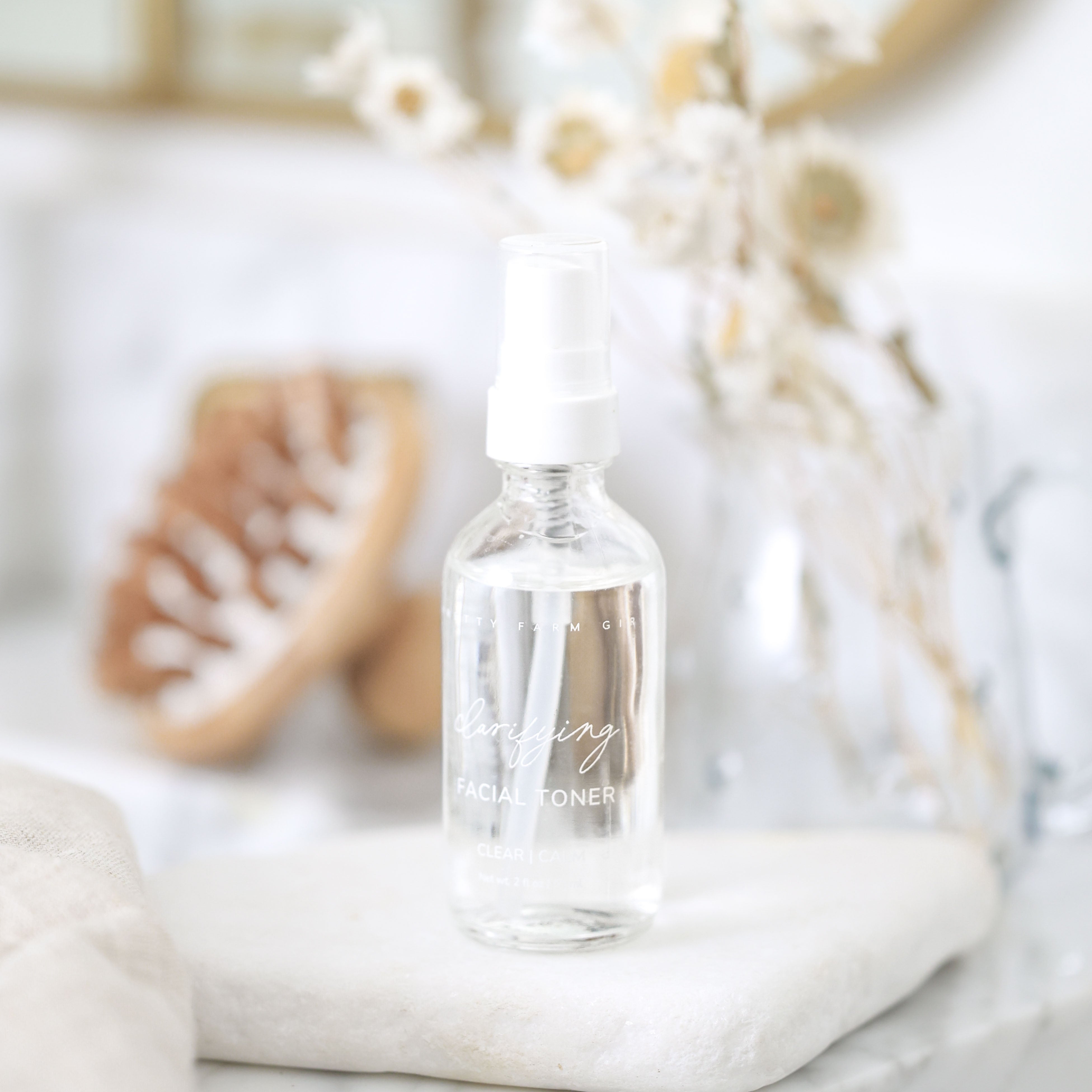 Clarifying hypochlorous acid toner in glass spray bottle from Pretty Farm Girl for Made Brave