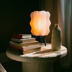 Wavy Lamp warm ambient glow styled in cozy home decor scene Wooj Design