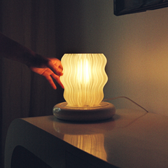 Mini Wavy Lamp warm ambient glow on bedside table cozy corner