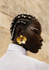 Close up of hand cut brass petal texture on Made Brave Deviendra earrings