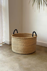 Close up of leather handle attachment on Made Brave large hamper