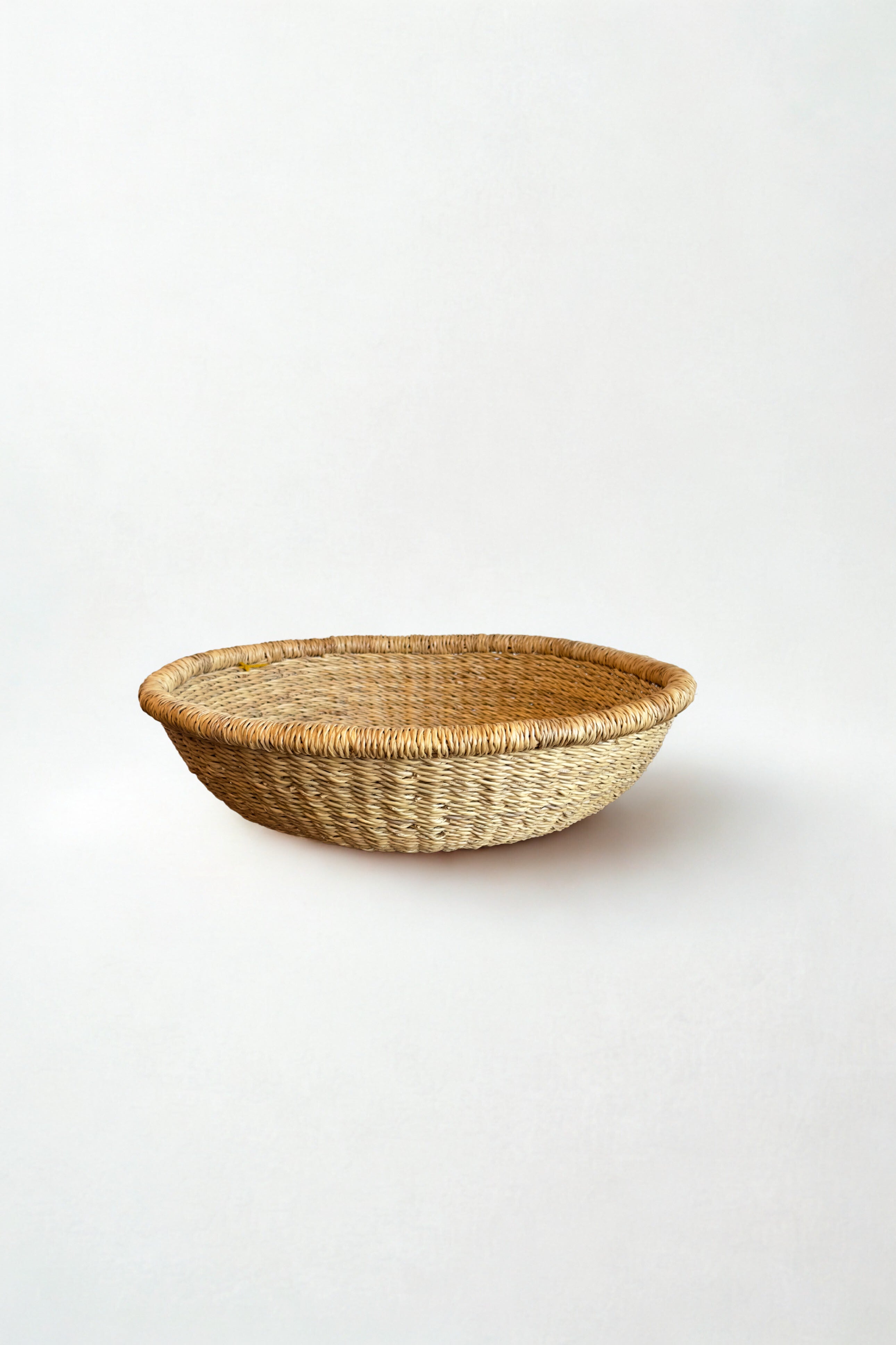 Large handwoven tray basket in natural fiber made in Ghana for Made Brave