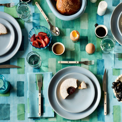 Close up of painted blue tapestry pattern on Made Brave tablecloth