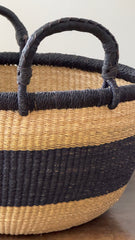 Made Brave large round Bolga basket styled on a console table